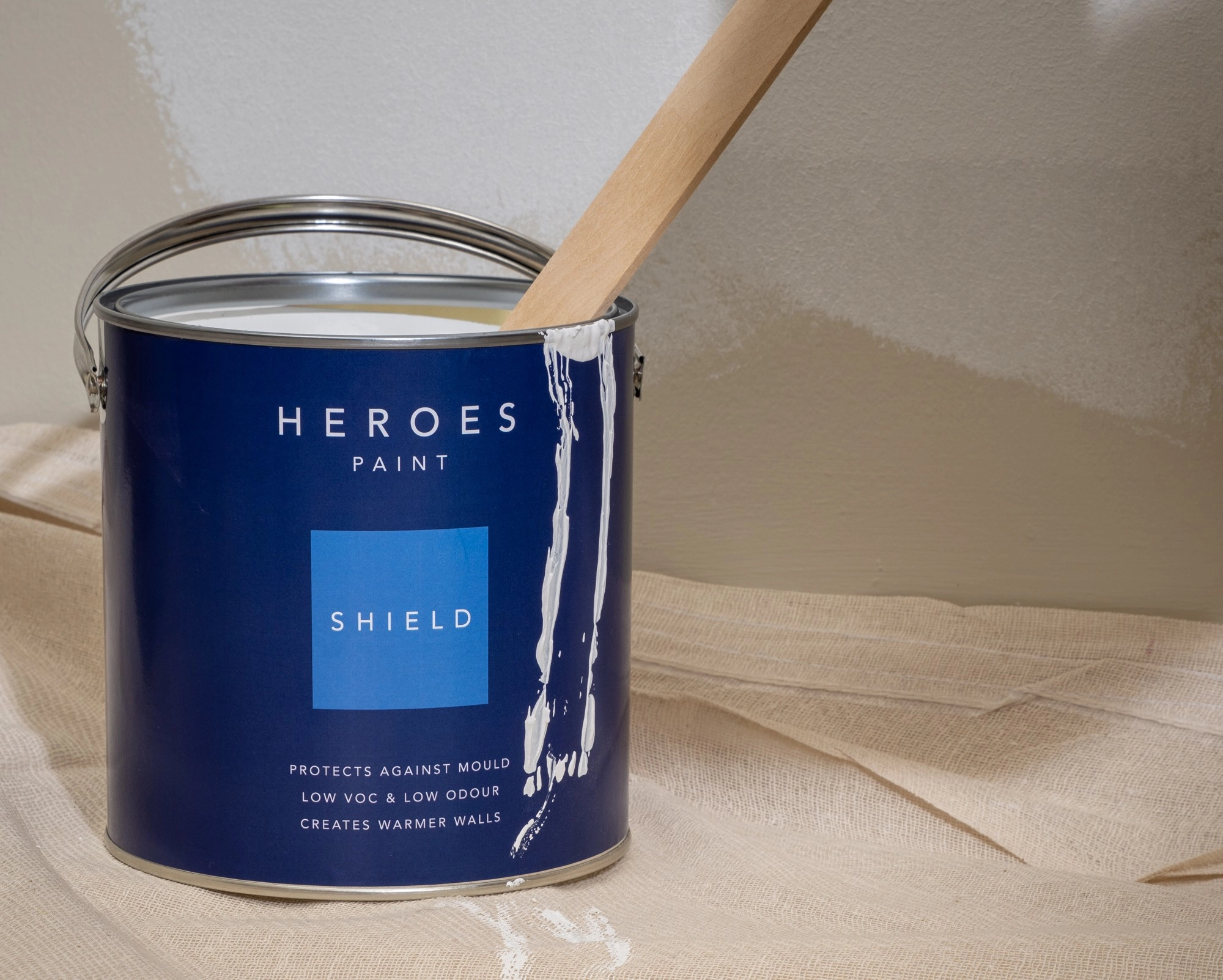 Heroes Shield tin with paint dripping down the side