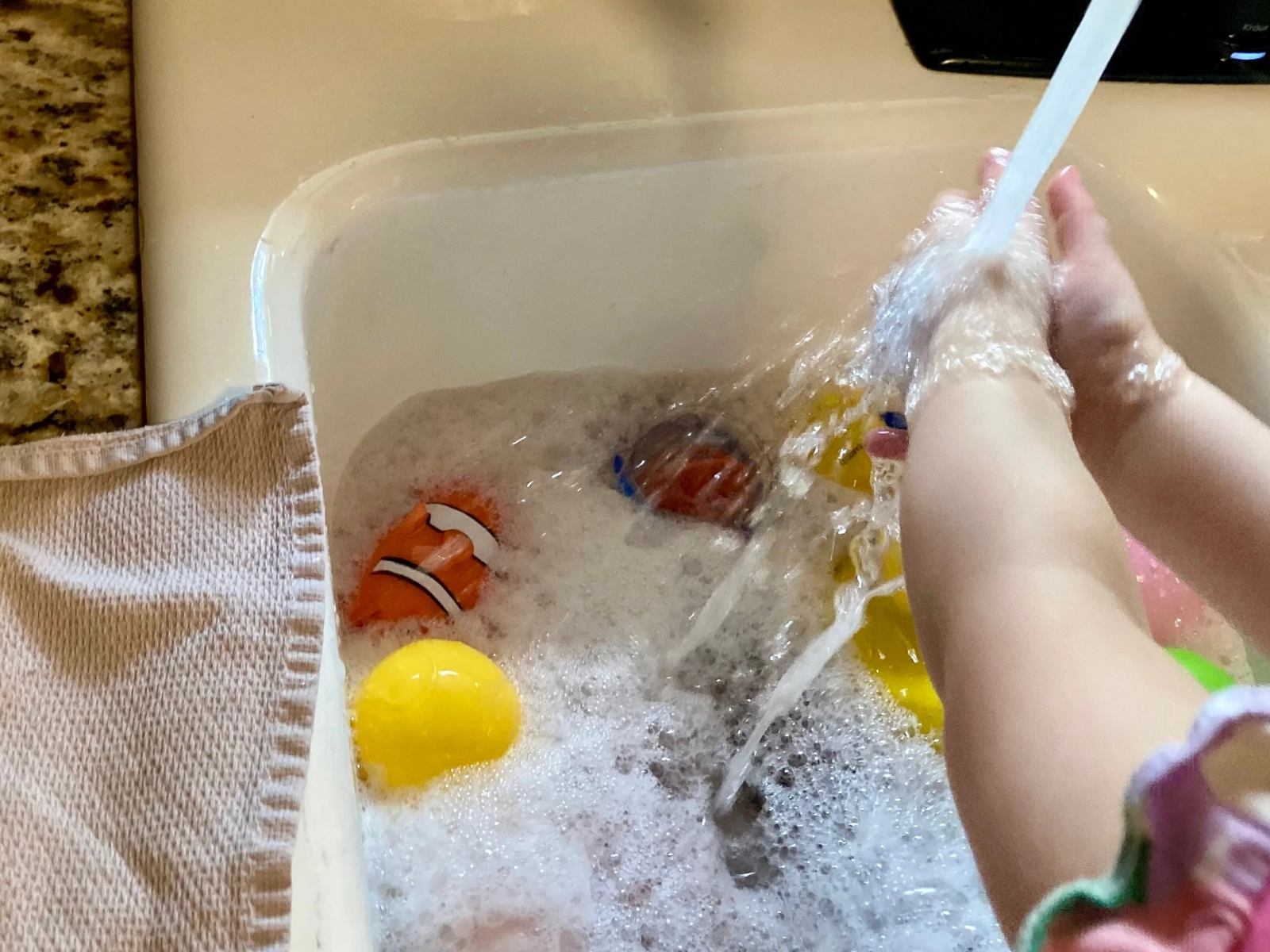 child washing hands